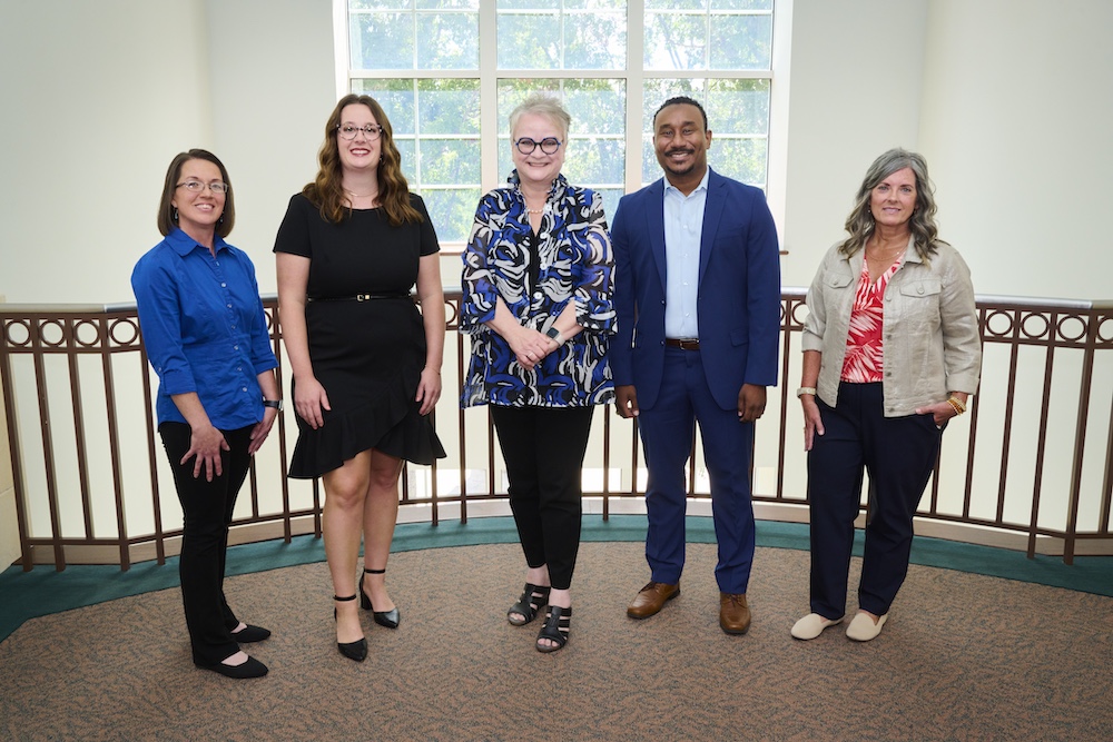 2024 Staff Excellence Award recipients from left, Jandy Kelley, Heather Caudle, Keith Ahee Jr. and Shelly Bellis with University President Alisa White.