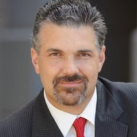 Jeremy Desel smiles for a photo.