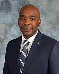 Kevin Smith smiles for a photo.