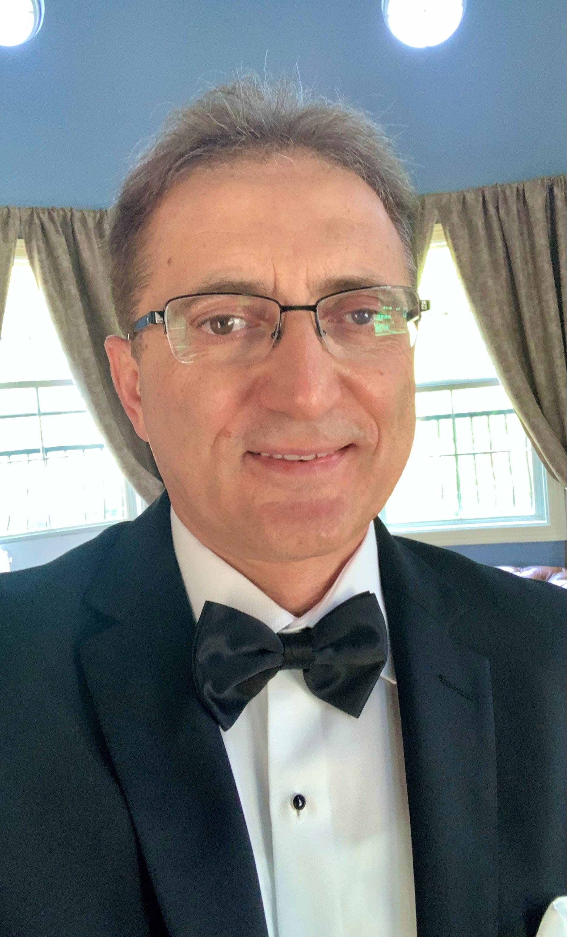 Recayi Pecen smiles for a photo.